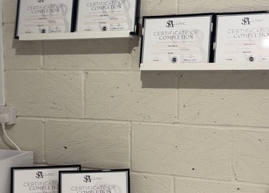 Certificates displayed at SNA Aesthetics, Darwen, England, GB denoting expertise in beauty treatments.