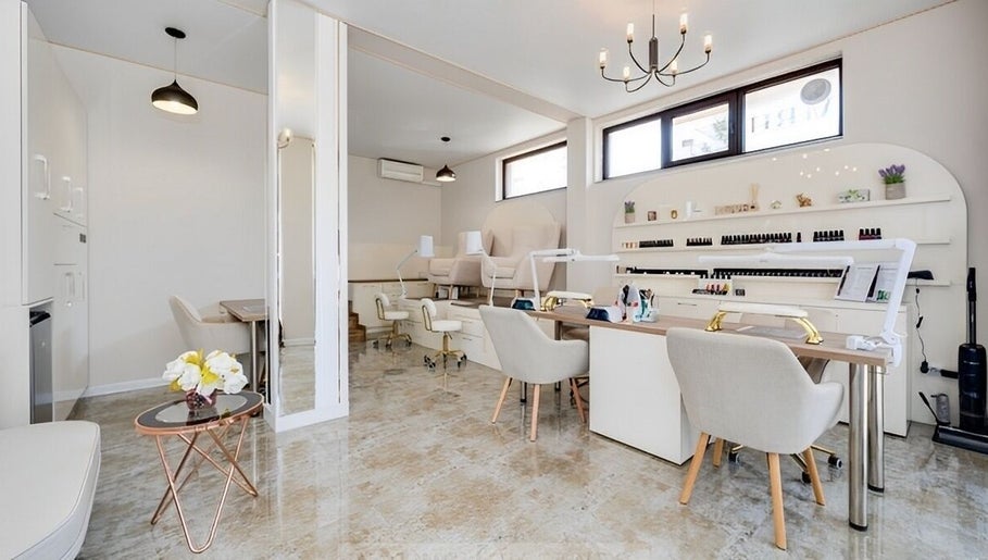 Elegant interior of Glow Nails & Academy in Бургас, Бургас, BG with modern nail stations and cozy decor.