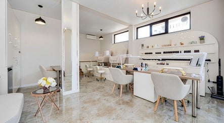Elegant interior of Glow Nails & Academy in Бургас, Бургас, BG with modern nail stations and cozy decor.