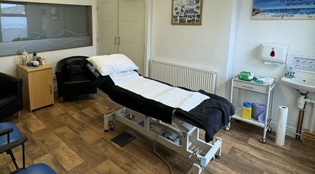 Massage therapy room at CP Sports Massage Therapy, Kenfig Hill, Wales, GB, featuring a comfortable treatment bed.