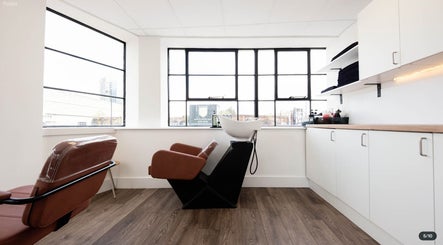 Modern hair wash station at Logvina Hair, London, England, GB featuring elegant design and natural light.