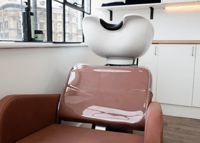 Modern hair wash station at Logvina Hair, London, England, GB, featuring sleek design and natural lighting.
