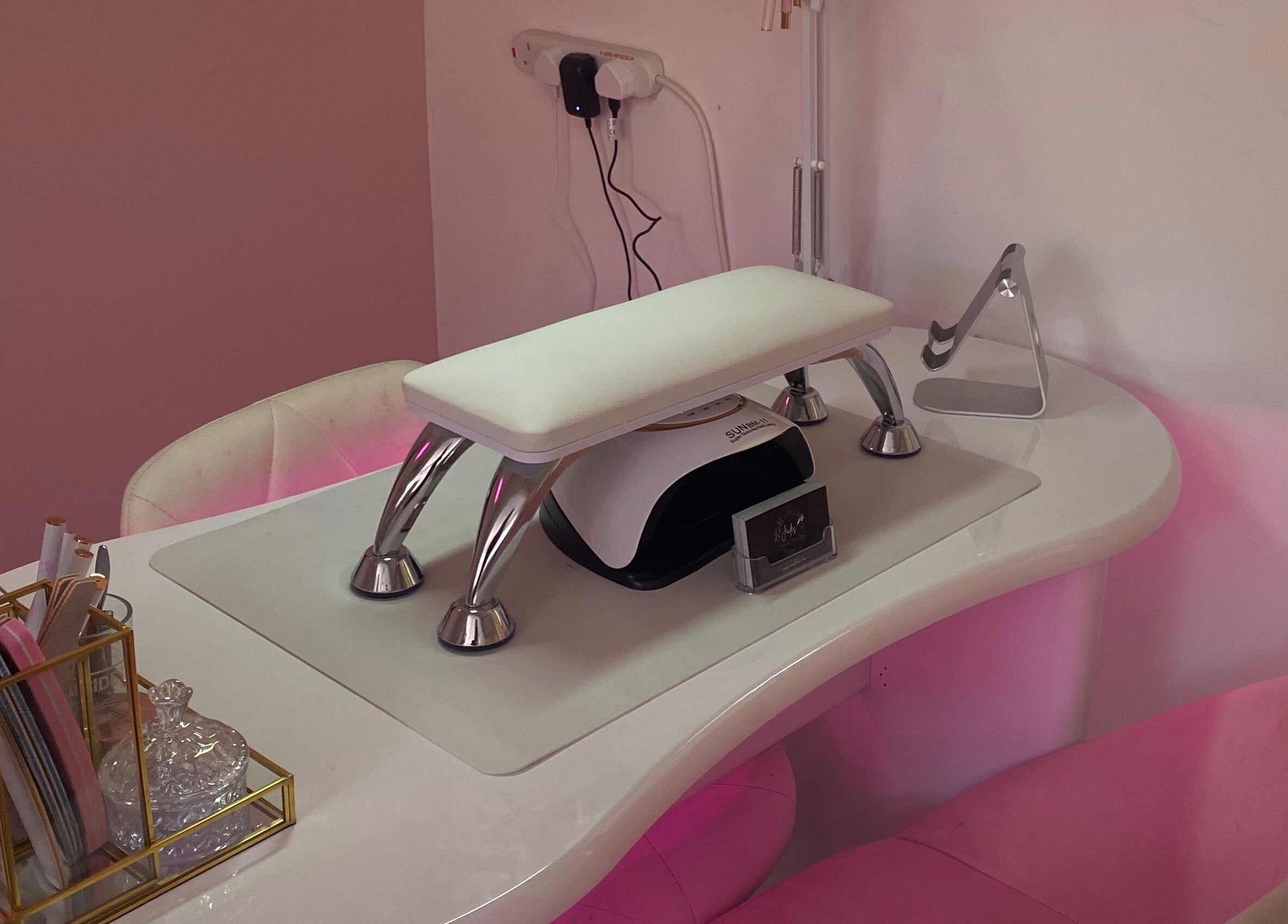 Polished nail station at Ink and Polish in Barnsley, England, GB, showcasing a stylish manicure setup.