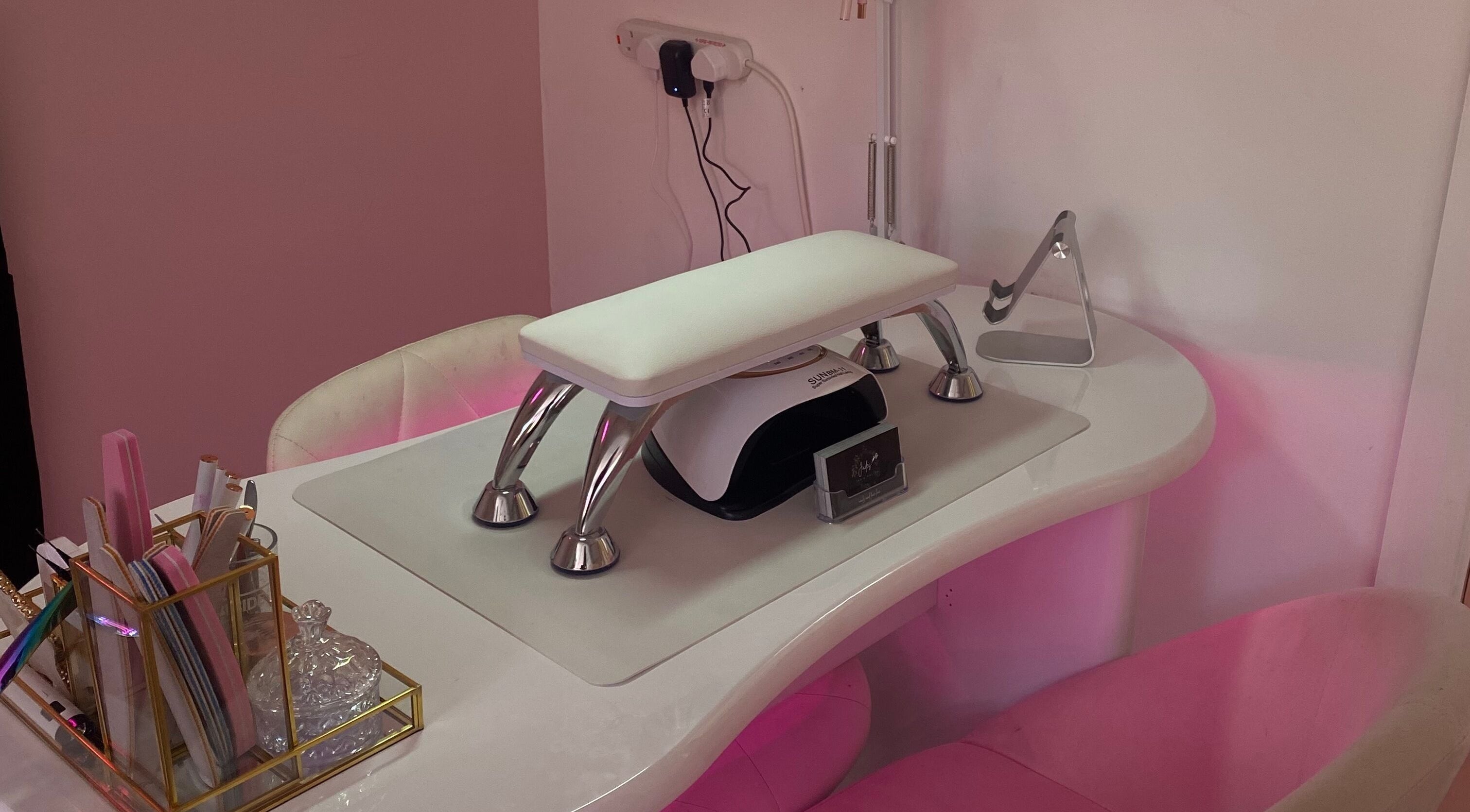 Polished nail station at Ink and Polish in Barnsley, England, GB, showcasing a stylish manicure setup.