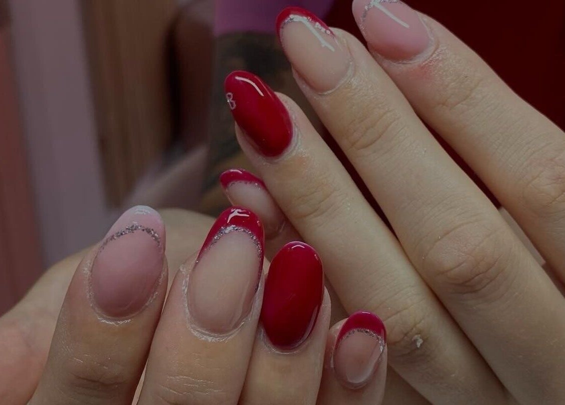 Elegant red and pink manicure at Ink and Polish, Barnsley, England, GB, showcasing exquisite nail art.