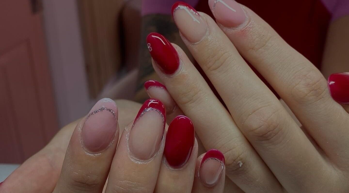 Elegant red and pink manicure at Ink and Polish, Barnsley, England, GB, showcasing exquisite nail art.