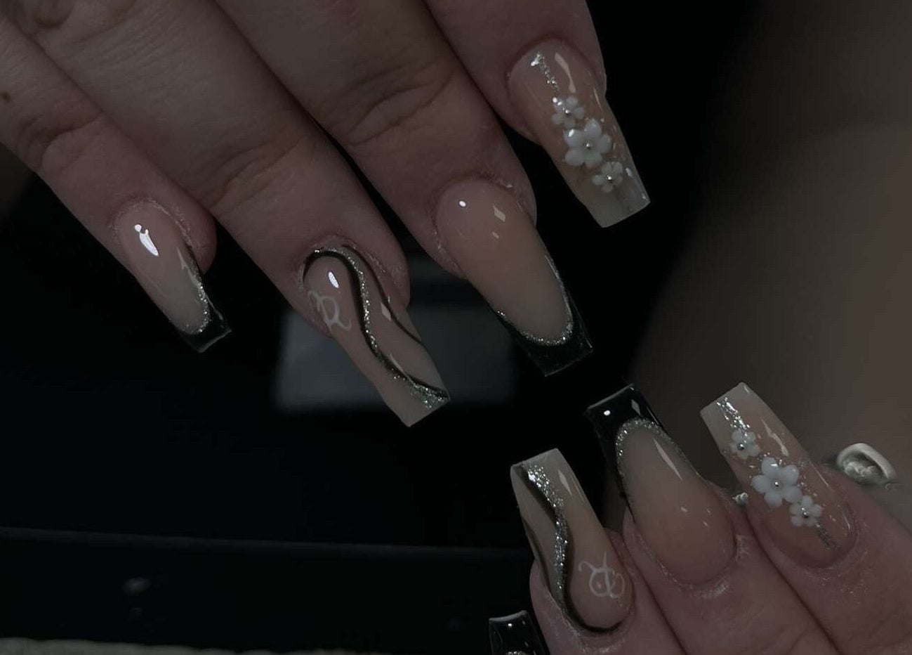 Elegant floral nail art by Ink and Polish, Barnsley, England, GB, showcasing intricate designs and glossy finish.