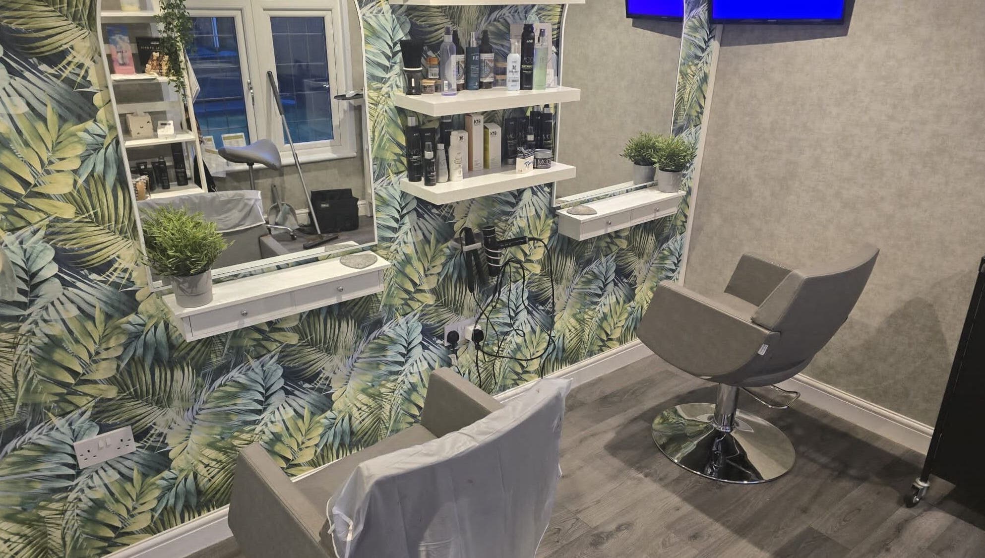 Modern salon chair and tropical decor at Hair By Claire in Harwich, England, GB.