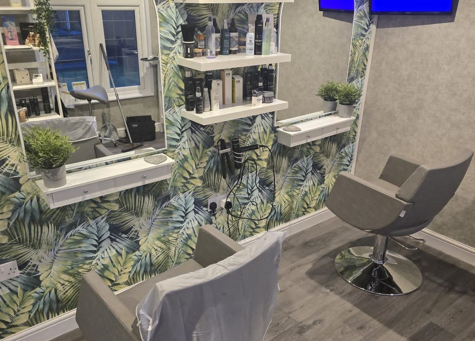 Modern salon chair and tropical decor at Hair By Claire in Harwich, England, GB.