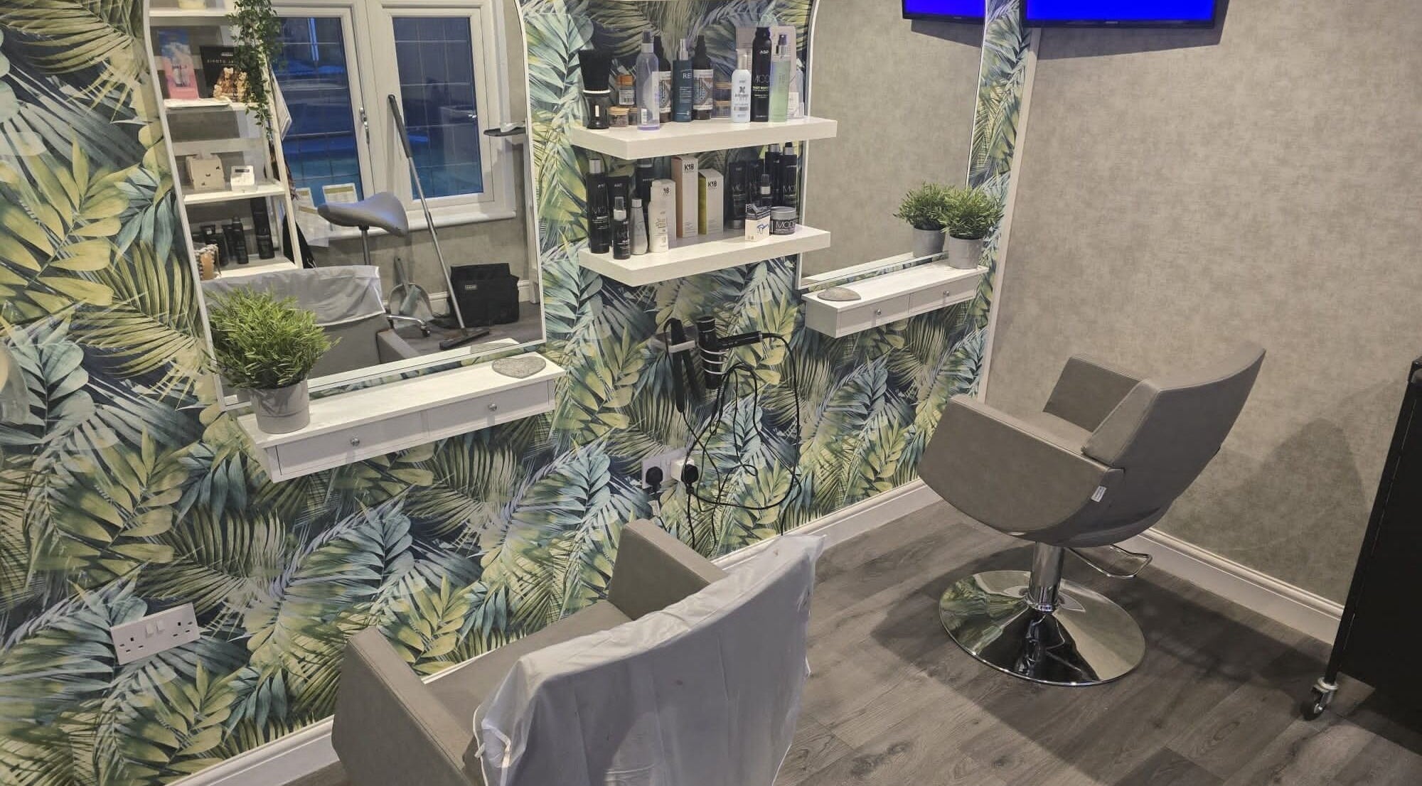 Modern salon chair and tropical decor at Hair By Claire in Harwich, England, GB.