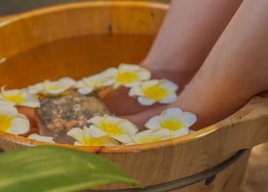 Relaxing foot soak with flowers at Choojai Thai Massage in Richmond, Victoria, AU.