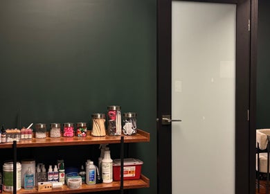 Elegant Aesthetics in Calgary, Alberta, CA showcases a serene corner with neatly arranged treatment supplies.