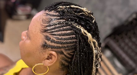 Beautiful braided hairstyle at Crownedbyexperience, Chicago, Illinois, US.