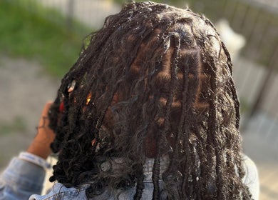 Intricate braiding style at Crownedbyexperience in Chicago, Illinois, US. Beautiful and detailed hair design.