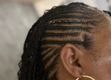 Close-up of elegant cornrows hairstyle at Crownedbyexperience, Chicago, Illinois, US.