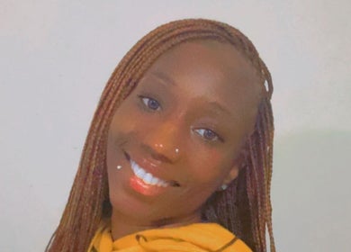 Smiling person representing warmth at Crownedbyexperience, Chicago, Illinois, US.
