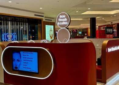 Brow Threads & Lashes Tea Tree Plaza venue in Modbury, South Australia, AU featuring illuminated signage.