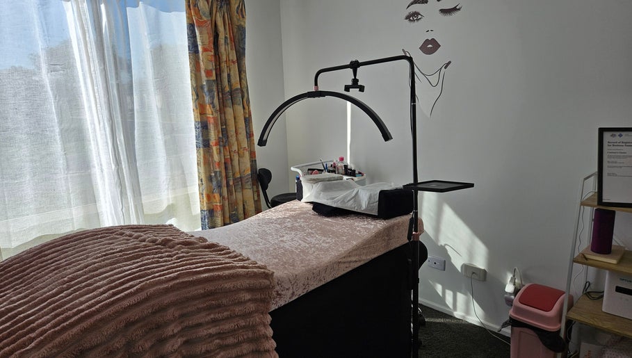 Relaxing treatment room at Courtney's Classics, Melbourne, Victoria, AU, featuring a cozy bed and stylish decor.