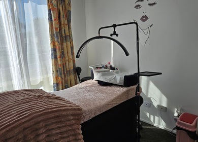 Relaxing treatment room at Courtney's Classics, Melbourne, Victoria, AU, featuring a cozy bed and stylish decor.