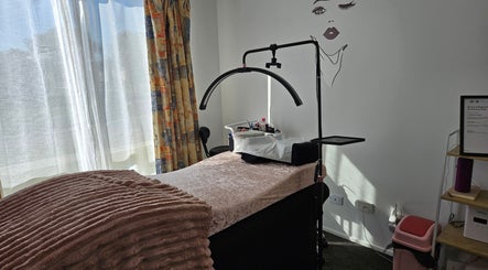 Relaxing treatment room at Courtney's Classics, Melbourne, Victoria, AU, featuring a cozy bed and stylish decor.
