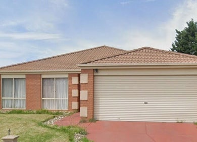 Front view of Courtney's Classics in Melbourne, Victoria, AU showcasing a charming brick structure and garage.