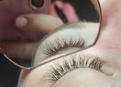 Close-up of lush lashes at Courtney's Dreamy Lashes, Melbourne, Victoria, AU, reflected in glasses.