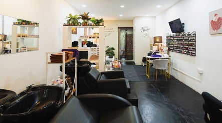 Elegant interior of Bliss Salon in Kuala Lumpur, featuring nail polish racks and cozy seating areas.