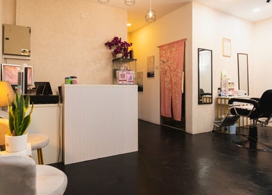 Modern interior of Bliss Salon, Kuala Lumpur, with elegant decor and styling chairs.