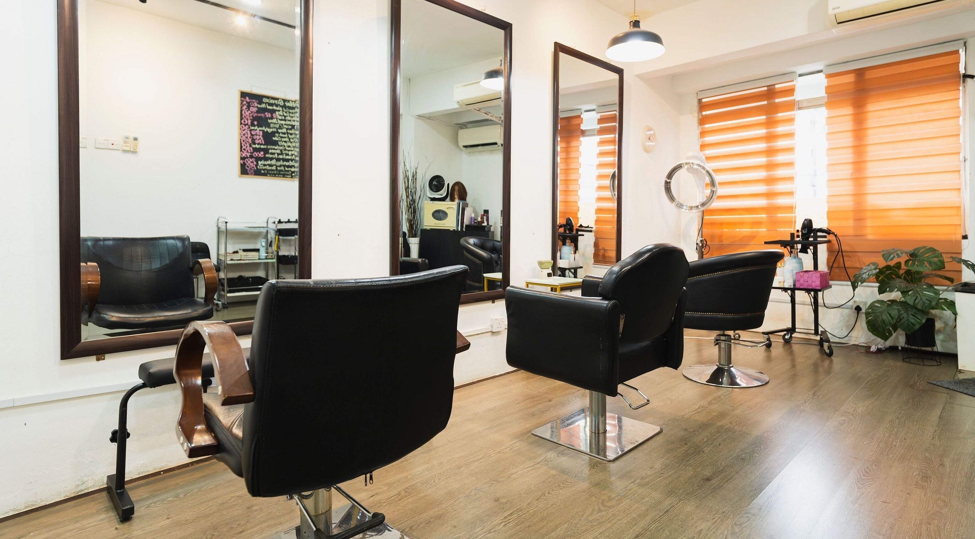 Modern salon chairs at Bliss Salon, Kuala Lumpur, Wilayah Persekutuan Kuala Lumpur, MY offering a stylish setting.