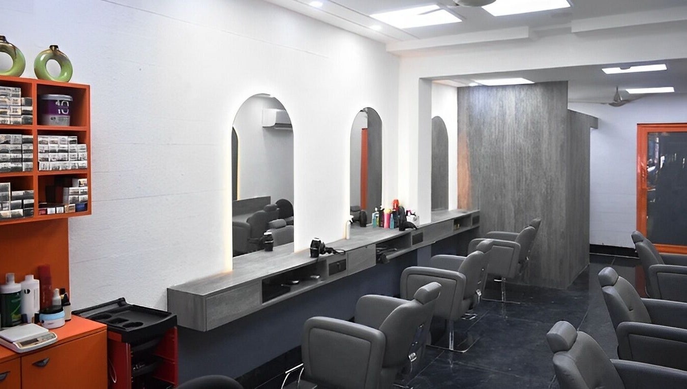 Modern salon interior with chic chairs and mirrors at The Specialist Unisex Salon, New Delhi, Delhi, IN.
