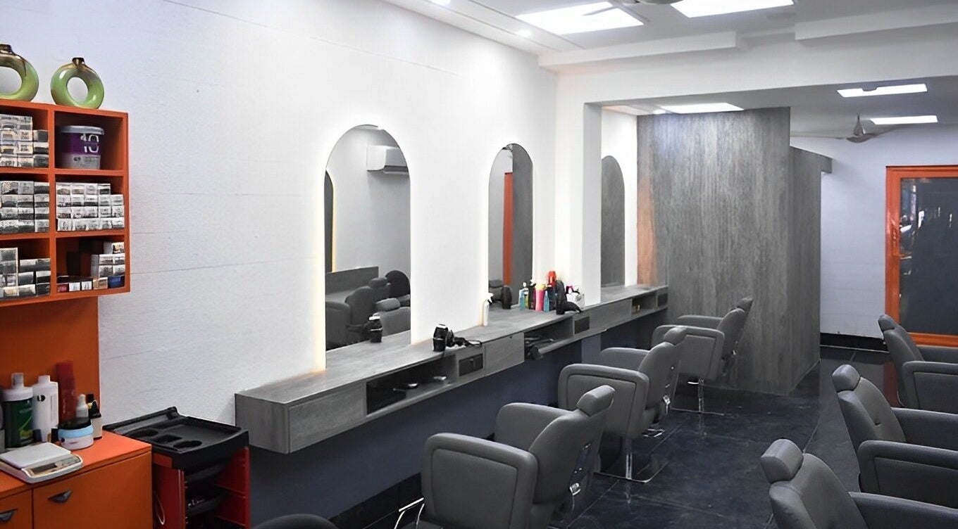 Modern salon interior with chic chairs and mirrors at The Specialist Unisex Salon, New Delhi, Delhi, IN.