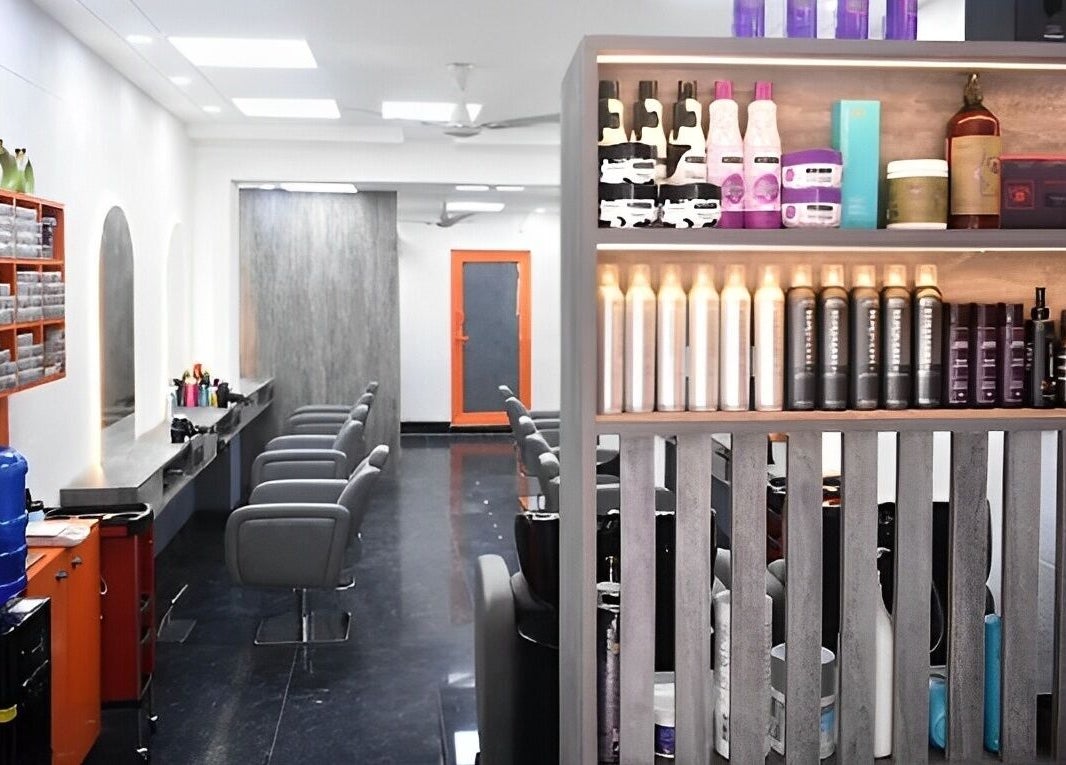 Modern interior of The Specialist Unisex Salon in New Delhi, Delhi, IN featuring stylish chairs and product display.