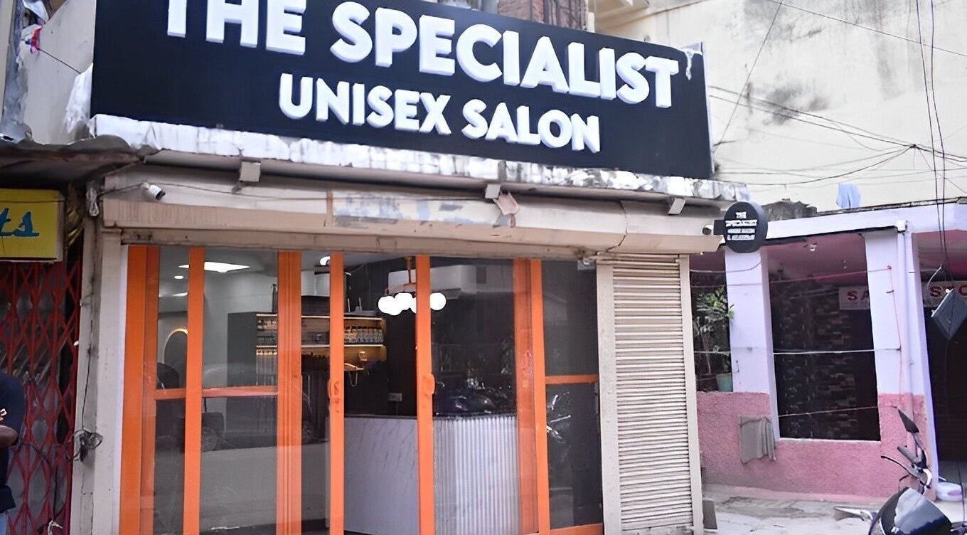 Front view of The Specialist Unisex Salon in New Delhi, Delhi, IN showcasing its inviting entrance.