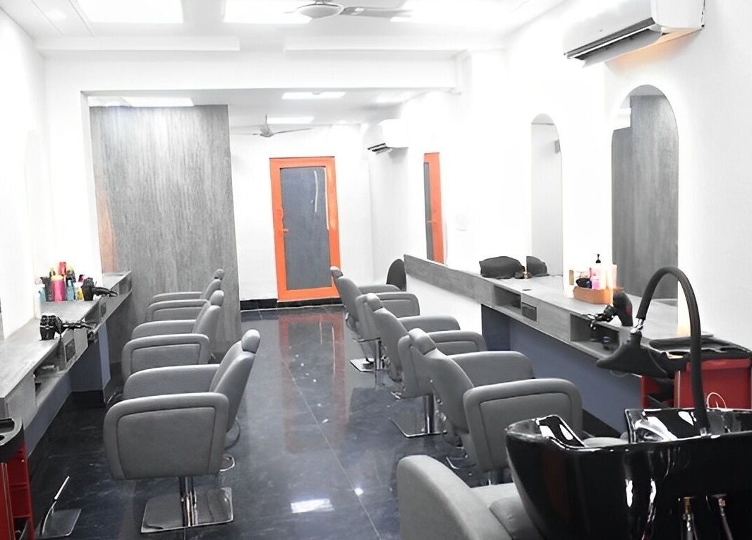 Elegant interior of The Specialist Unisex Salon in New Delhi, Delhi, IN showcasing stylish salon chairs and mirrors.