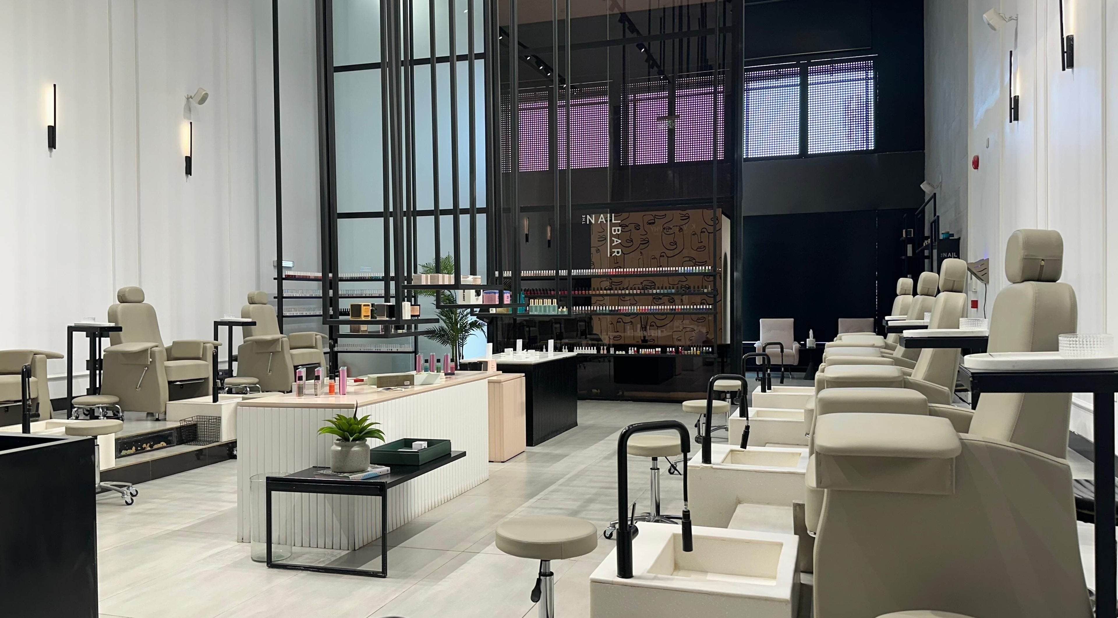 Elegant interior of The Nail Bar - Takhassousi, Riyadh, Riyadh Province, SA showcasing luxurious pedicure stations.