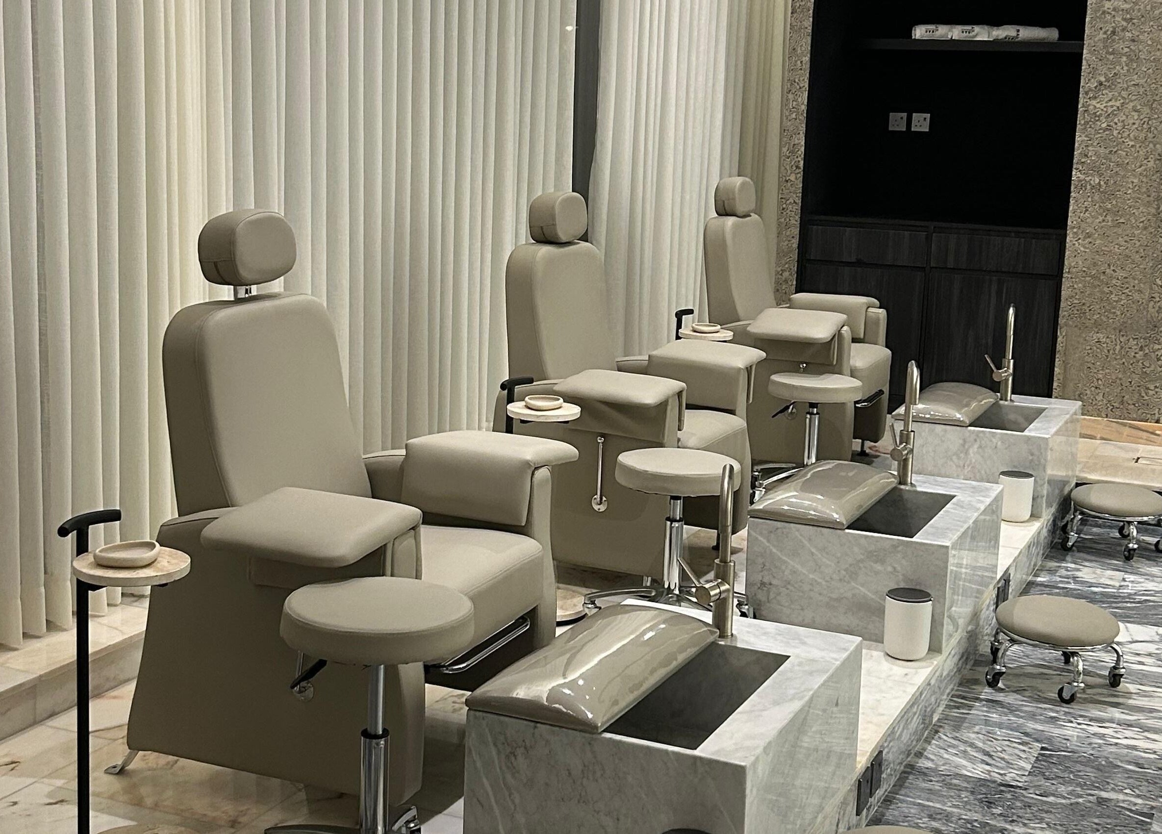 Luxury pedicure chairs at The Nail Bar - Sulaymaniyah in Riyadh, Riyadh Province, SA, displaying comfort and style.