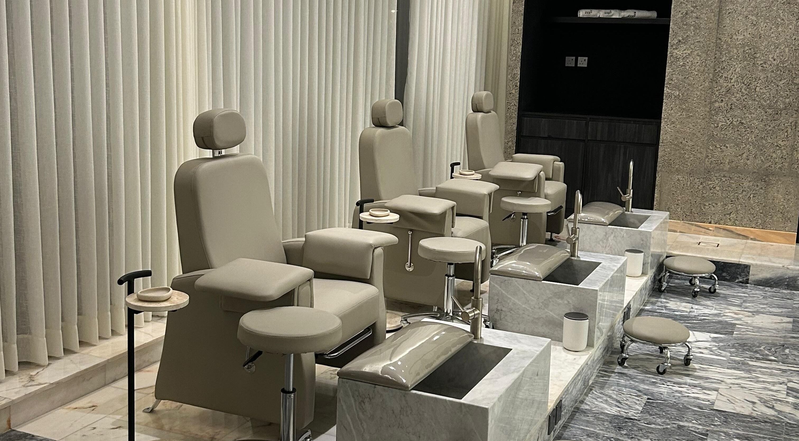 Luxury pedicure chairs at The Nail Bar - Sulaymaniyah in Riyadh, Riyadh Province, SA, displaying comfort and style.