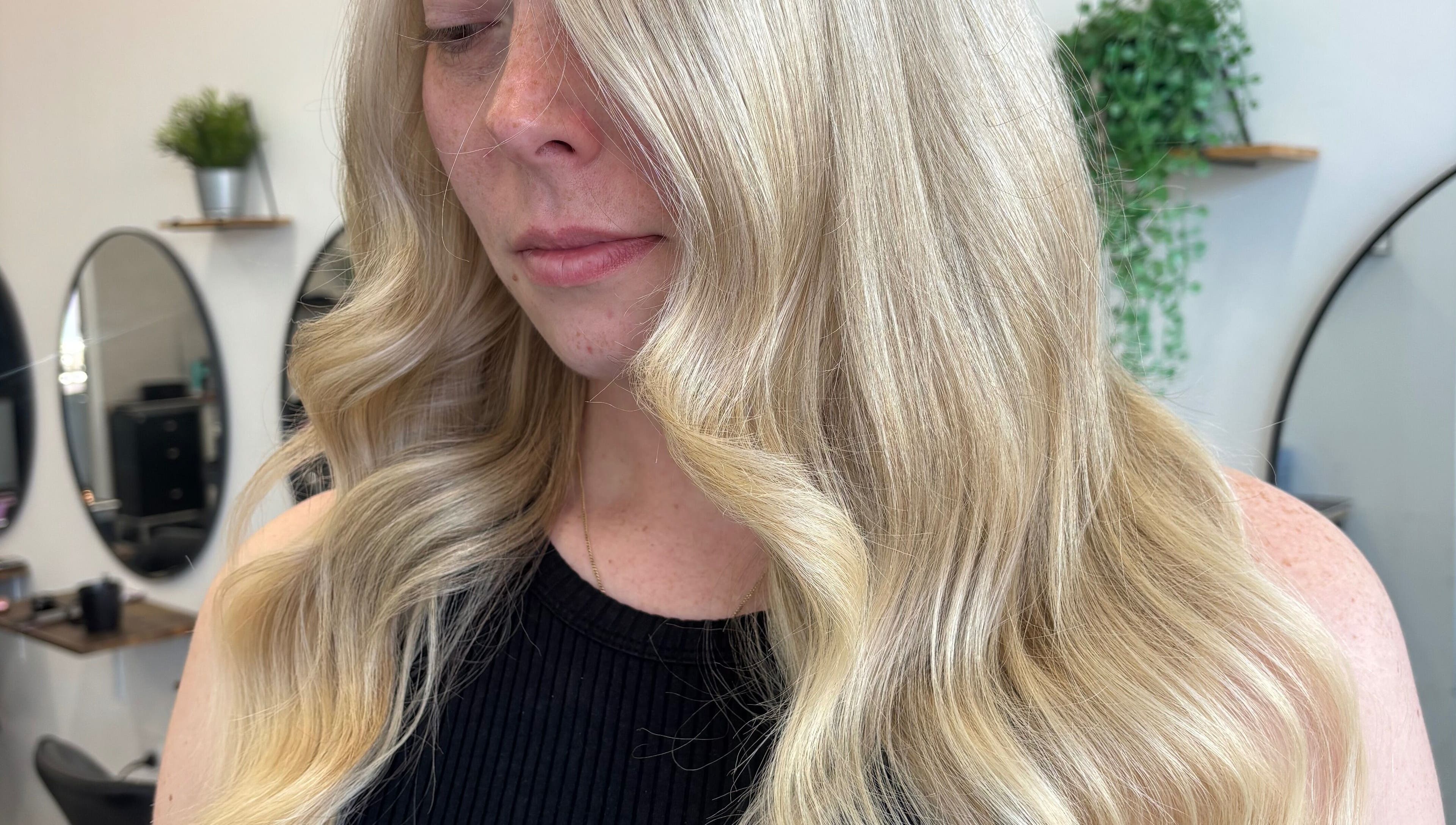 Elegant blonde waves styled at Hair by Emma Sturt, Beenleigh, Queensland, AU showcasing professional hair artistry.