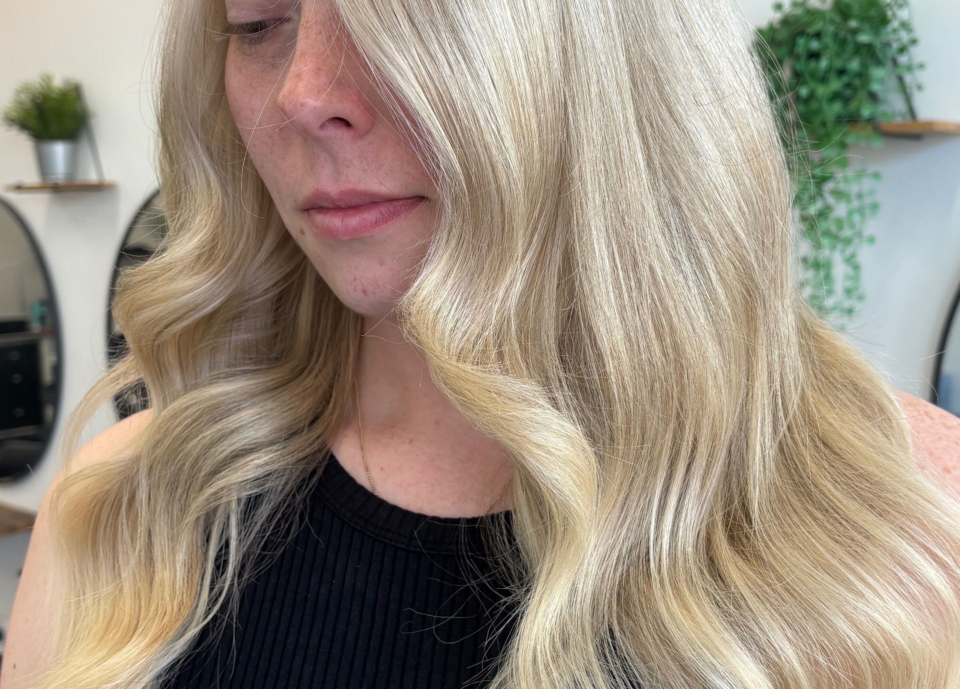 Elegant blonde waves styled at Hair by Emma Sturt, Beenleigh, Queensland, AU showcasing professional hair artistry.