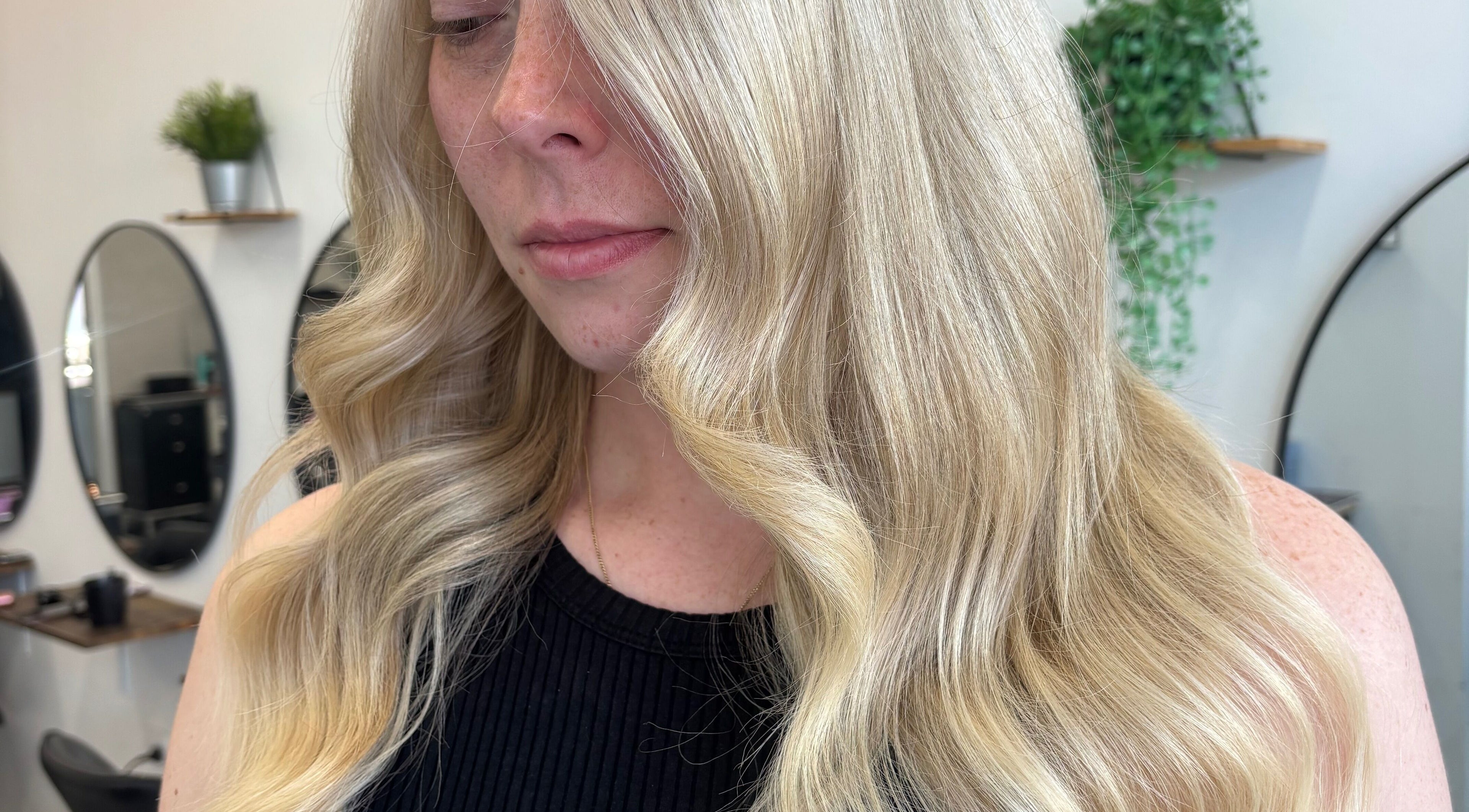 Elegant blonde waves styled at Hair by Emma Sturt, Beenleigh, Queensland, AU showcasing professional hair artistry.