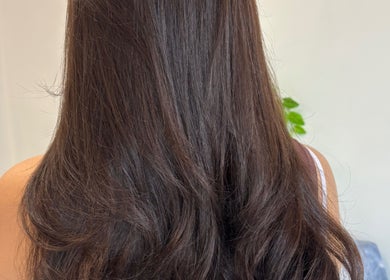 Smooth, shiny brunette hair styled at Hair by Emma Sturt, Beenleigh, Queensland, AU. Enhancing natural elegance.