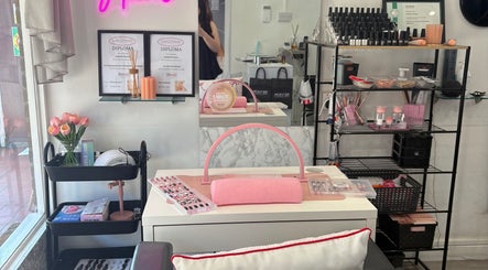 Nail salon interior at NailsByIzabelle, Arundel, England, GB showcasing elegant decor and professional setup.