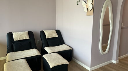 Cozy massage chairs at U Mi Massage in Lenoir City, Tennessee, US, with calming decor and ambiance.