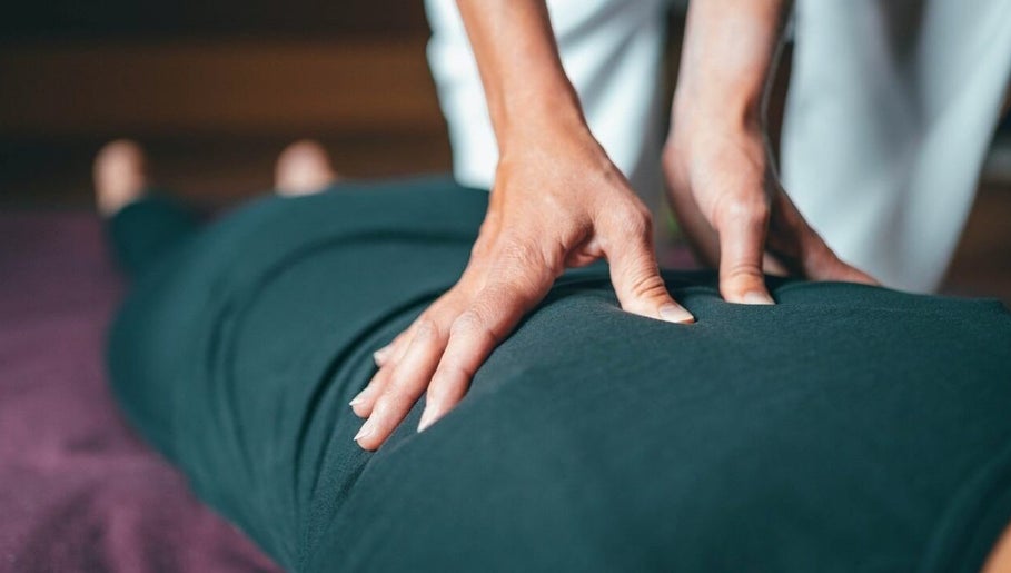 Hands providing massage therapy at Fusion Elite Performance Therapy, Aylesbury, England, GB.