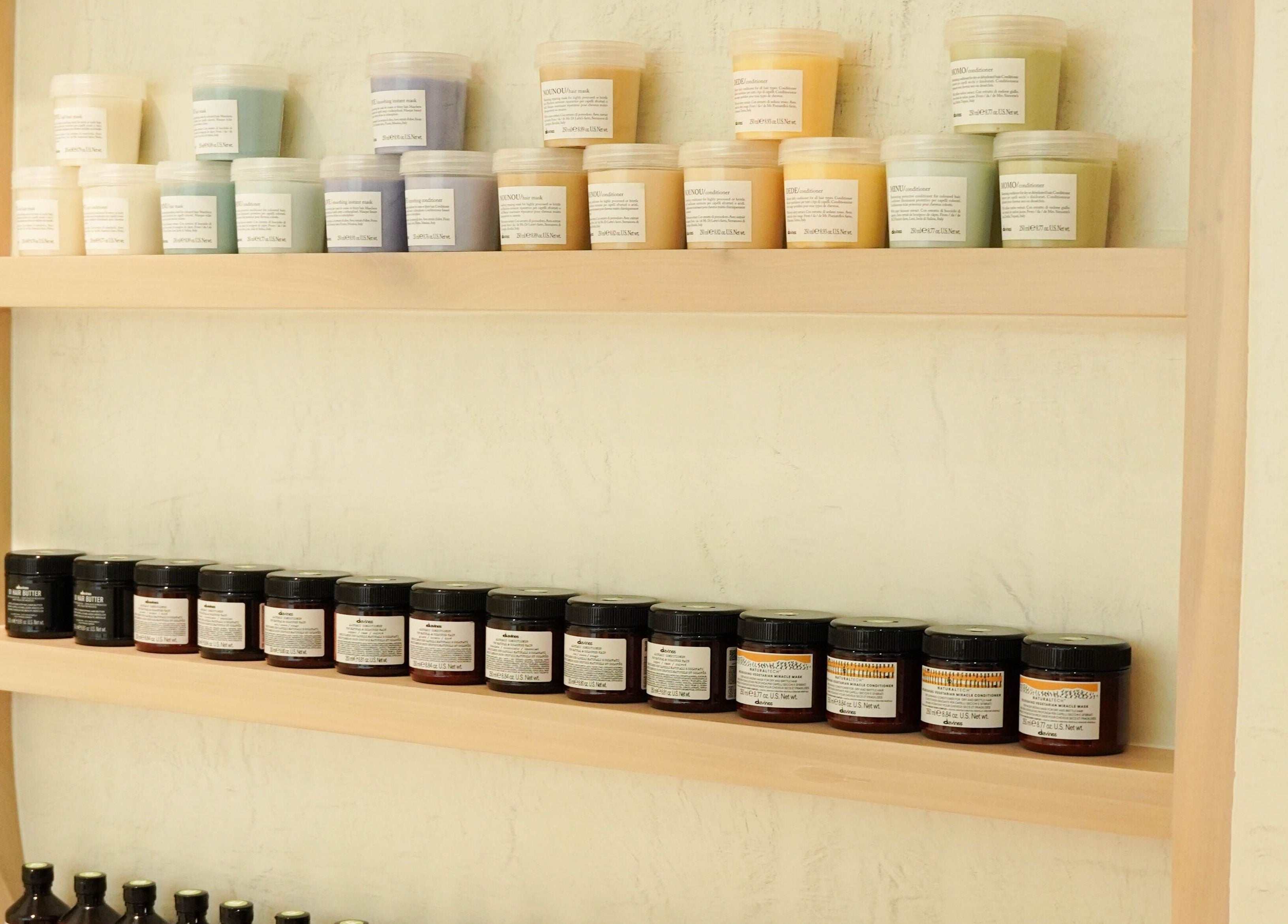 Product-filled shelves at Couture Studio, Taguig, Metro Manila, PH, showcasing various beauty care items.