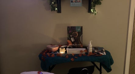 Cozy relaxation spot at Bliss & Beauty by Nikki at Serenity, Leek, England, GB, with candles and beauty products.