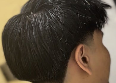 Close-up of a sleek haircut at BARBER CFS, Gambang, Pahang, MY showcasing expert styling.