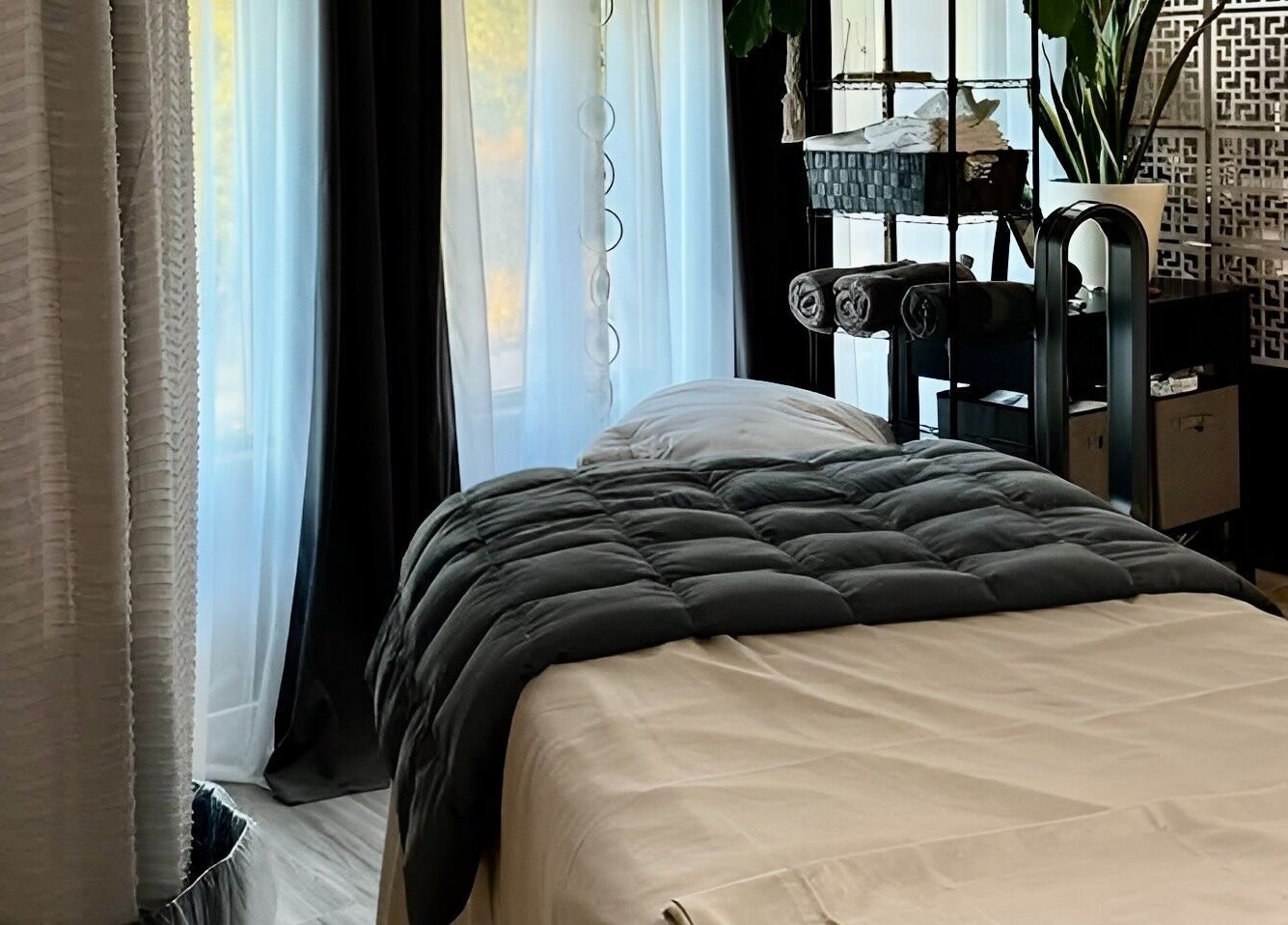 Relaxing massage room at Essential Luxuries Day Spa in Snohomish, Washington, US. Luxurious, calming ambiance.