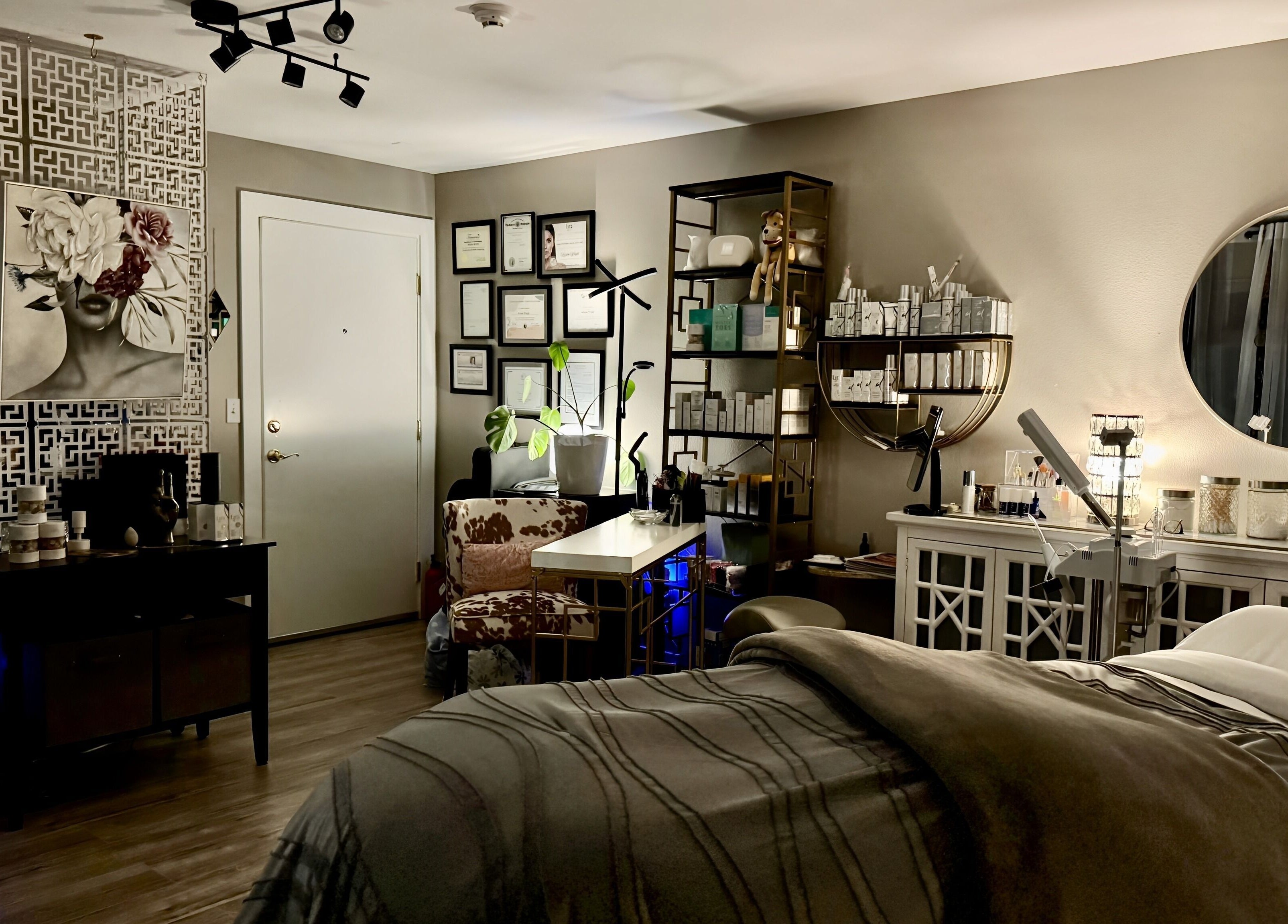 A serene treatment room at Essential Luxuries Day Spa, Snohomish, Washington, US, with elegant decor and amenities.