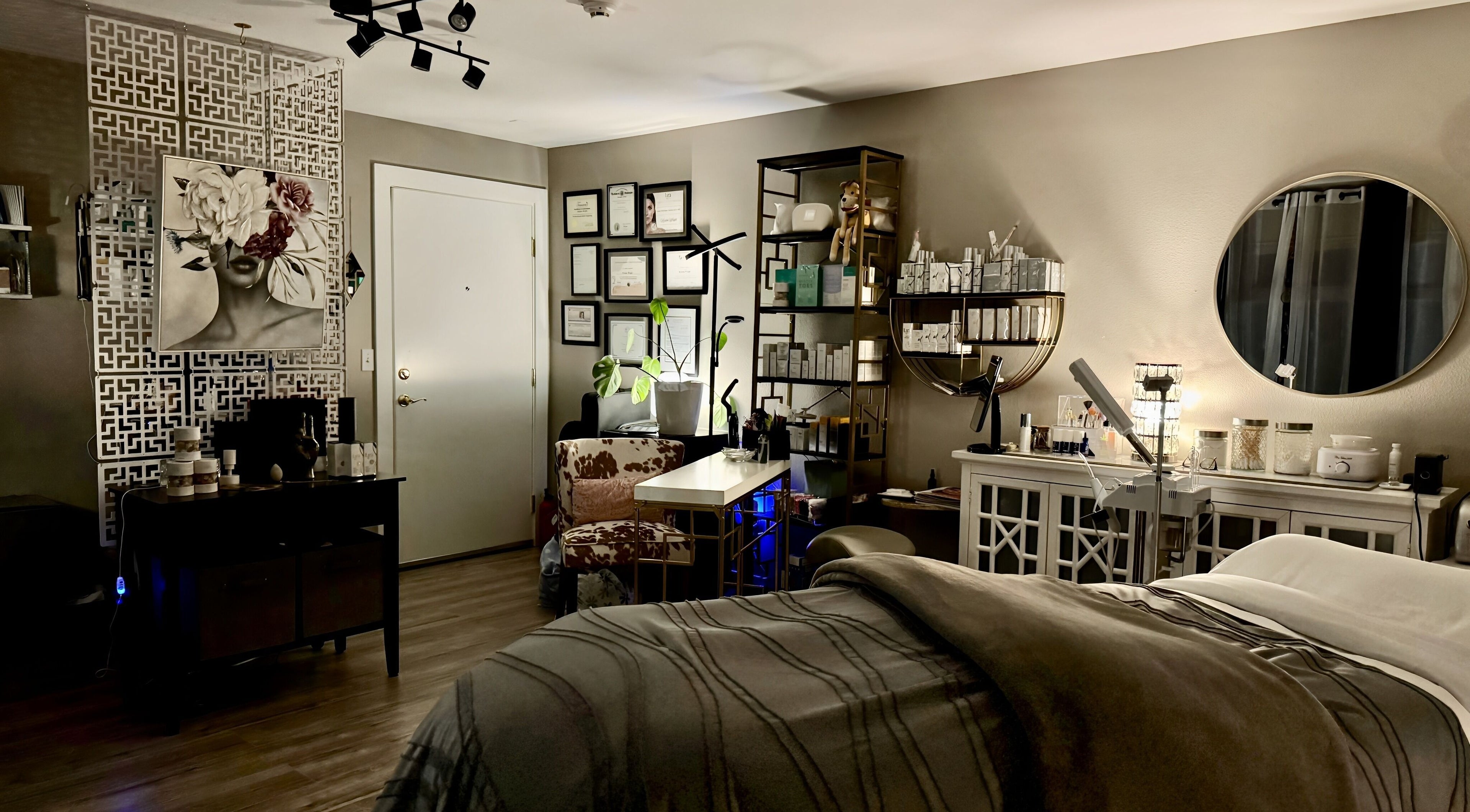 A serene treatment room at Essential Luxuries Day Spa, Snohomish, Washington, US, with elegant decor and amenities.